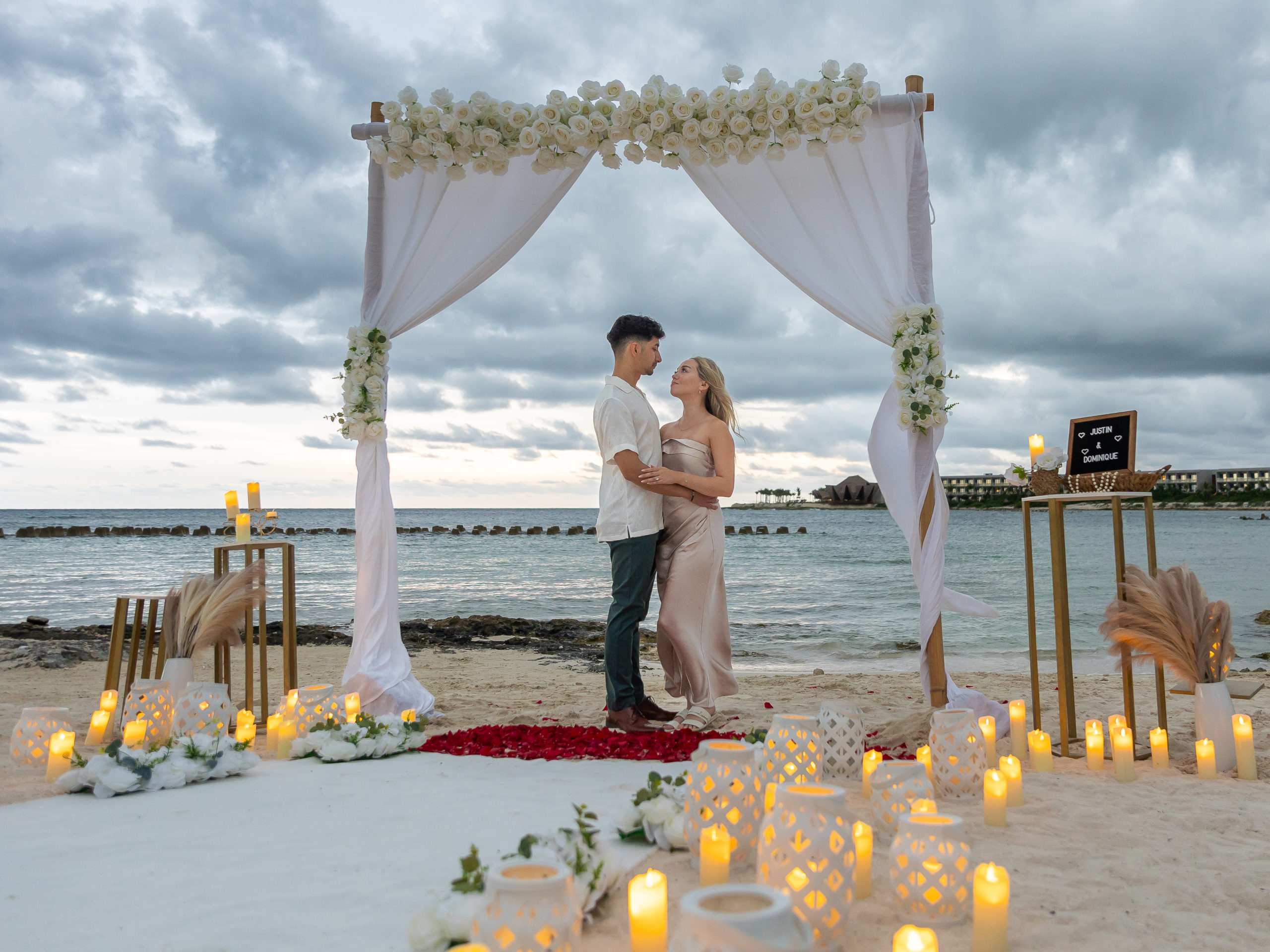 Bamboo arch proposal with an ocean backdrop at Hilton Tulum
