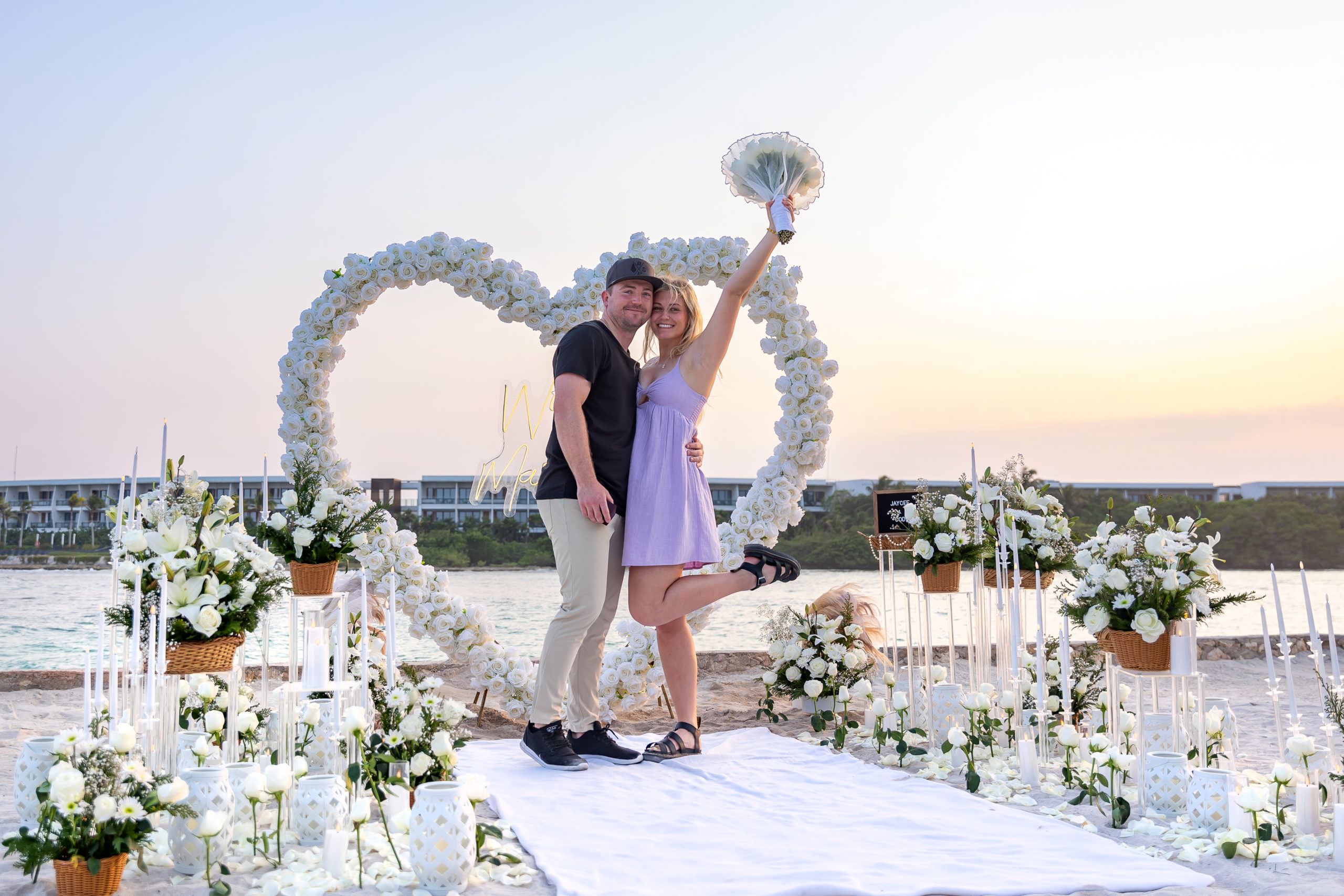 Joyful couple after their sunset proposal at Conrad Tulum