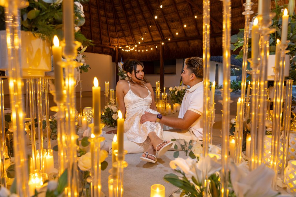 Luxury beach proposal walkway with candles and fresh flowers at Acamaya Weddings Puerto Morelos during sunset