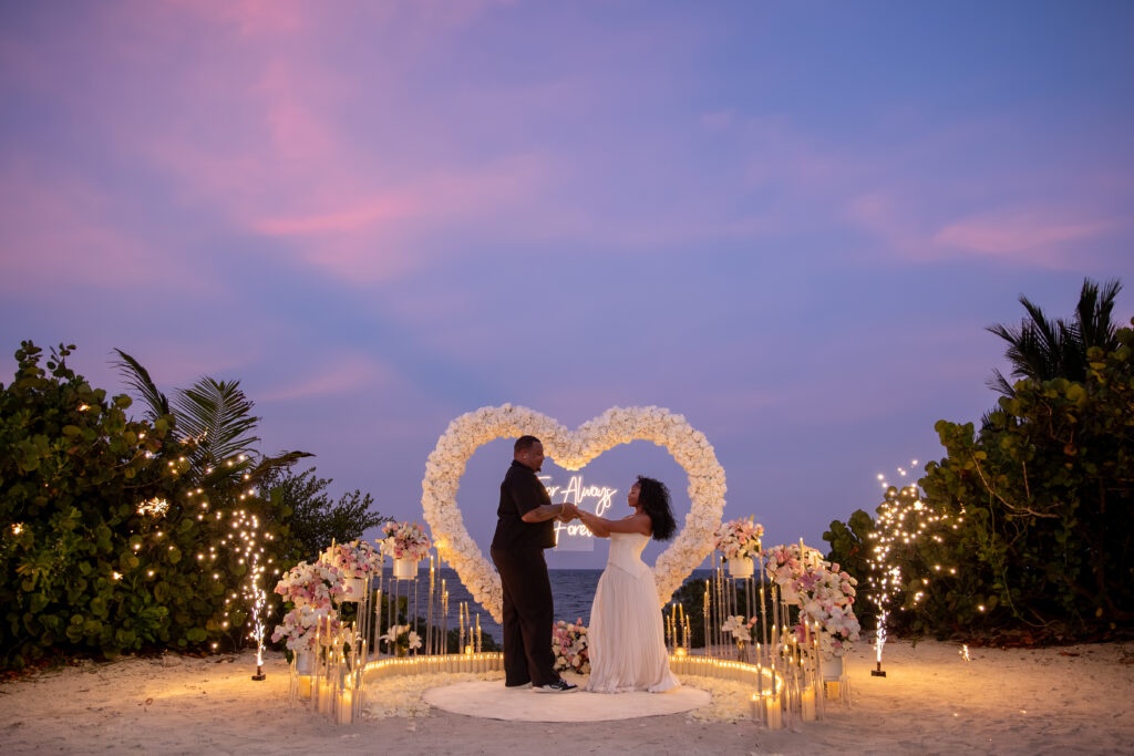 Couple celebrating at a beach micro-wedding
