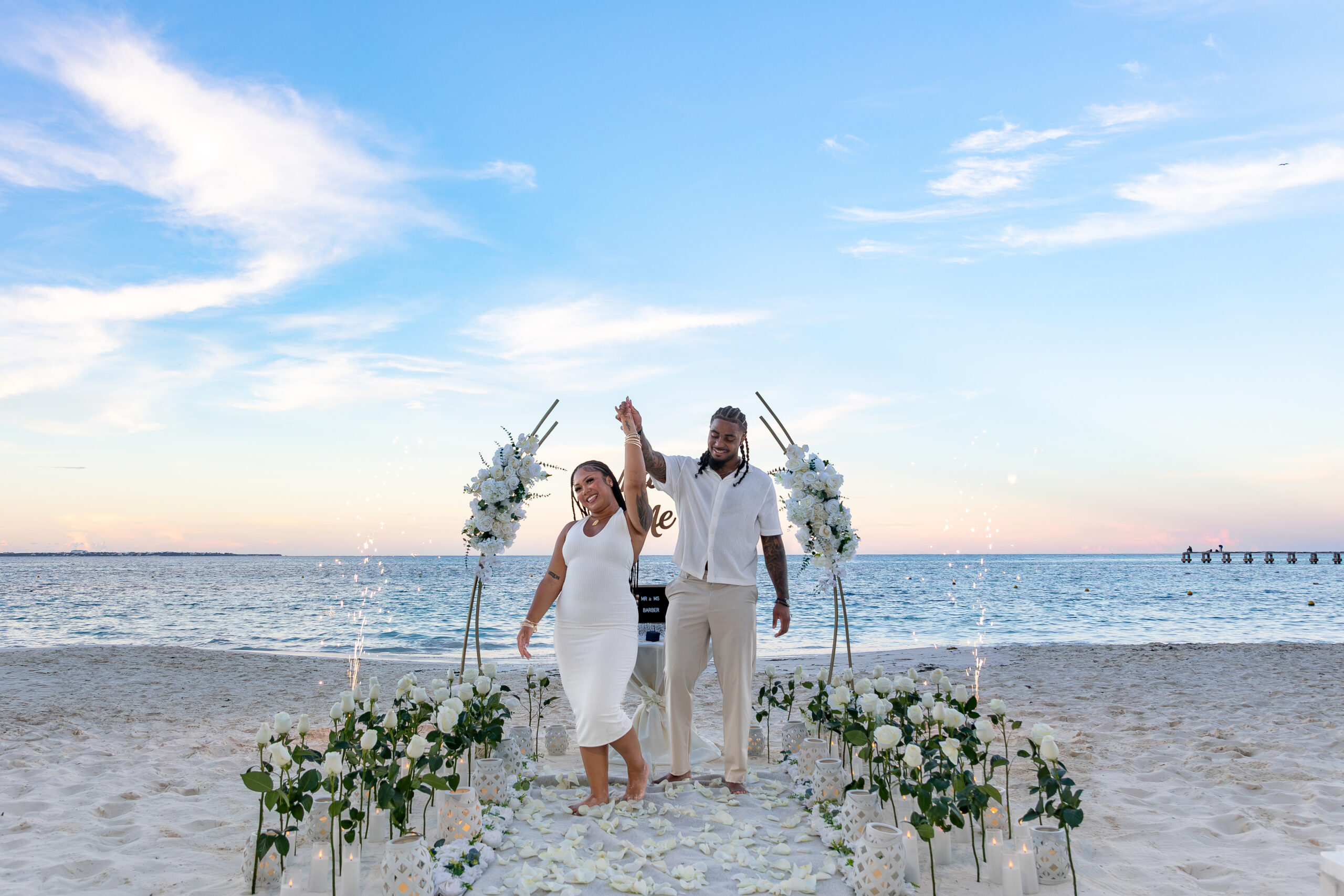 Newly engaged couple celebrating a luxury beach proposal in Cancun